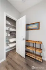 Linen closet with adjustable shelves dedicated to your visitor's privacy and conenience. Luxury your friends and fam will love!