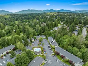 Here's a drone shot of the surrounding area.  This condo community has great access to shopping, transit and nearby trails.