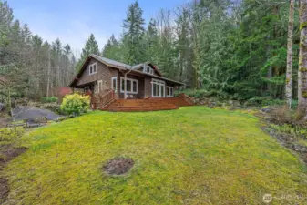 Side view of home and pond with waterfall