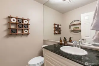 Lavish main level guest bath.