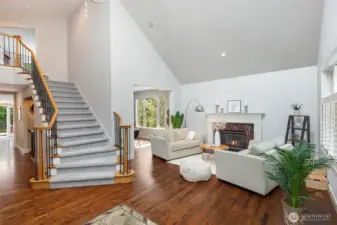 Wide staircase with iron banisters leading to the second floor.