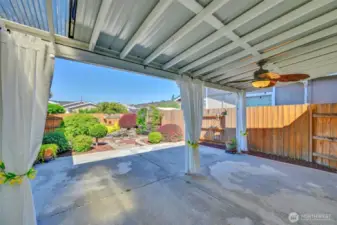 Dine in comfort with views of the tranquil backyard.