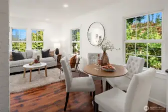 A nice sized dining area is just bewteen the living room and kitchen and looks out at the gorgeous side yard.