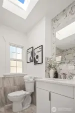 A skylight in the bathroom brings in extra light making this a stunning bath.