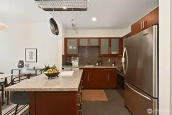 The center kitchen island offers great prep space and allows your guests to be part of the culinary experience.