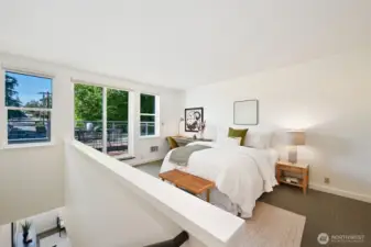 As you reach the top of the staircase, go left to the second bedroom which can also be used as an office, play space, music room, guest room and so much more. The sliding doors lead to the 400 sq ft deck. The large closet in this room also houses the full size laundry. Notice how the indoor and outdoor spaces merge so well-another characteristic of MCM design.