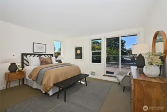 The primary bedroom is large and beautiful and has its own set of sliding doors that lead to the spectacular view deck. Please watch your step as you go in and out!