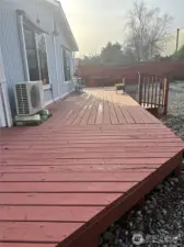 Deck wraps around 3 sides of home