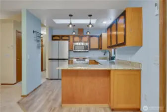 Kitchen has incredible storage and skylight