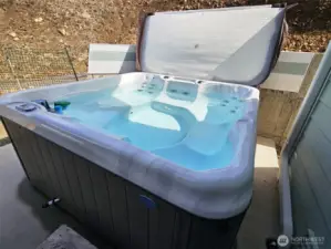 After a long day at work, kick on the jets of the hot tub and enjoy the privacy and views