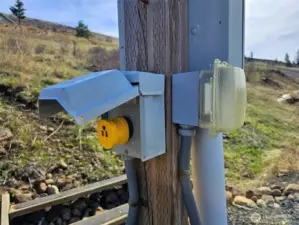 RV hookup, power and water to lower cleared area, room for barn, small shop or garage