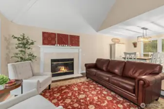 Front room has cozy wood-burning fireplace.