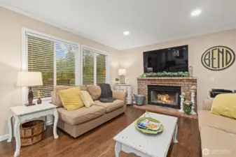 Another wood-burning fireplace in this living room off of the kitchen.