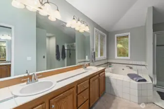 Spacious 5-piece primary bathroom.