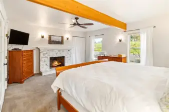 Primary bedroom wood burning fireplace