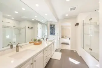 Full bathroom with tile flooring and shower over tub.