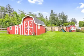 Custom barn is extra spacious w/loft inside & lean-to storage; great for storage, animals, play space!