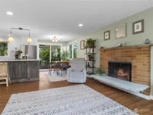 Open living to kitchen to socialize with the chef and easy entertainment. Wood burning fireplace up and down in this home.