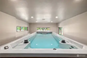 Immerse yourself in wellness in the pristine indoor swim spa pool; enjoyable year-round.