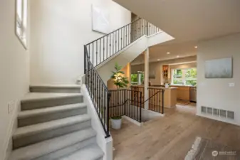 Gorgeous staircase leads to the 3rd floor. Soaring ceilings, tall windows and a skylight for additional natural light.