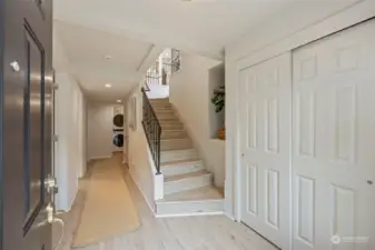 Inside you are welcomed with warm earth tones and an inviting stairwell.  There are two bedrooms on the lower level and one full bathroom, as well as a laundry room and access to the garage.