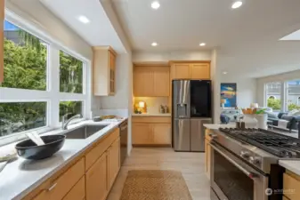 Well appointed kitchen has ample cabinets, modern appliances, and sleek cabinetry.