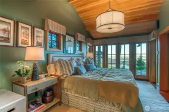 Main house-primary bedroom with a view!! French doors open up to patio.