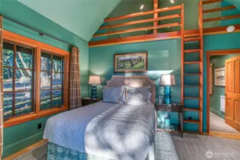 Sauna Cottage enjoys views of the forest and offers up a feeling of a warm welcome. Vaulted ceiling and big windows create a space to feel at home. Bonus loft is finished with carpeting. The doorway to the right opens up to a large hallway to the second entrance, full bath and sauna.