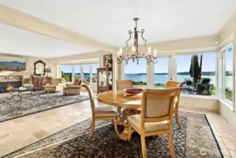 Enter through the magnificent solid wood doors, welcomed by natural stone floors and rooms filled walls of windows, that bring in the sunlight and beautiful vistas.