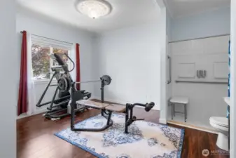 Second guest bedroom is located at the front of the home and features open, ADA accessible bathroom with walk-in shower.