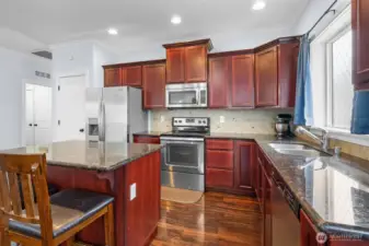 Crown molding tops the cherry cabinetry. Did you notice the pantry?