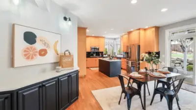 Enjoy a cozy kitchen nook perfect for your morning coffee just steps from the spacious dining area, which offers plenty of room for a large dining table close to the kitchen