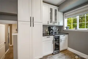 Coffee or wine anyone? Also large built in pantry cabinet & large window to enjoy your backyard view while making your favorite drink!
