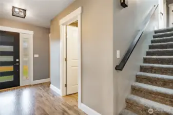 1/2 bath off entry & stairs leading to upper level