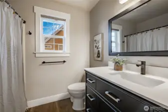 Full bathroom upstairs w/updated flooring, vanity, lighting & more