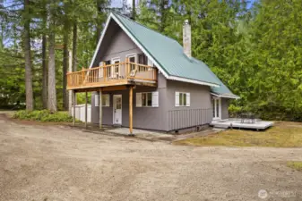 Covered back patio provides convenient access to the home.