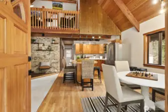 Warm, refinished hardwood floors extend throughout the main living space.