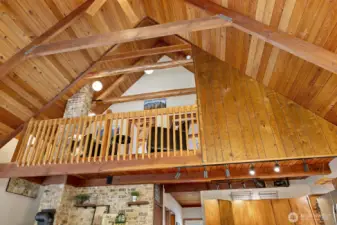 Soaring rich fur wood planked vaulted ceilings and exposed beams.