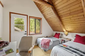 Second bedroom with private door leading to the upper-level deck.