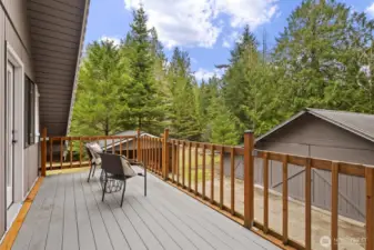 Upper-floor Trex deck with dual access from each bedroom & views of Teneriffe Falls.