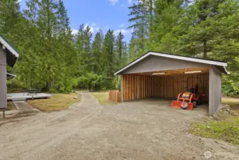 Spacious newer ~20x20 carport equipped with power.