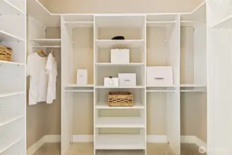 One of two primary walk-in closets.