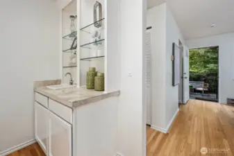 Small wet bar area off living room perfect for entertaining.