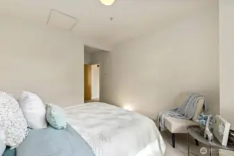 Open wall in primary bedroom is great for mounting a television.