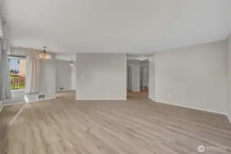 Living space to dining room and hallway entrance
