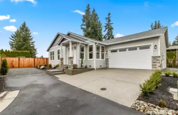 Home is Under construction. This exterior marketing photo is an Example only of a previously built 2 car garage single story home. Builder reserves the right to modify elevation and finish materials.