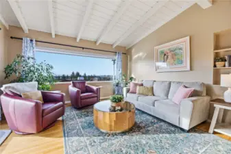 Exposed beam & tongue & groove vaulted ceilings let in the light.