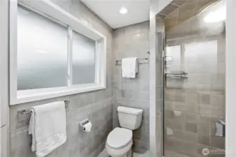 Primary bathroom wall to ceiling tile.