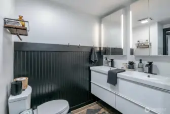 Hall bath, double sinks with full shower
