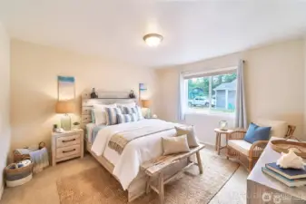 Bedroom 2 offers a warm and comfortable space with soft natural light and plenty of room for relaxing.